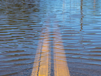 Water covering road due to flooding